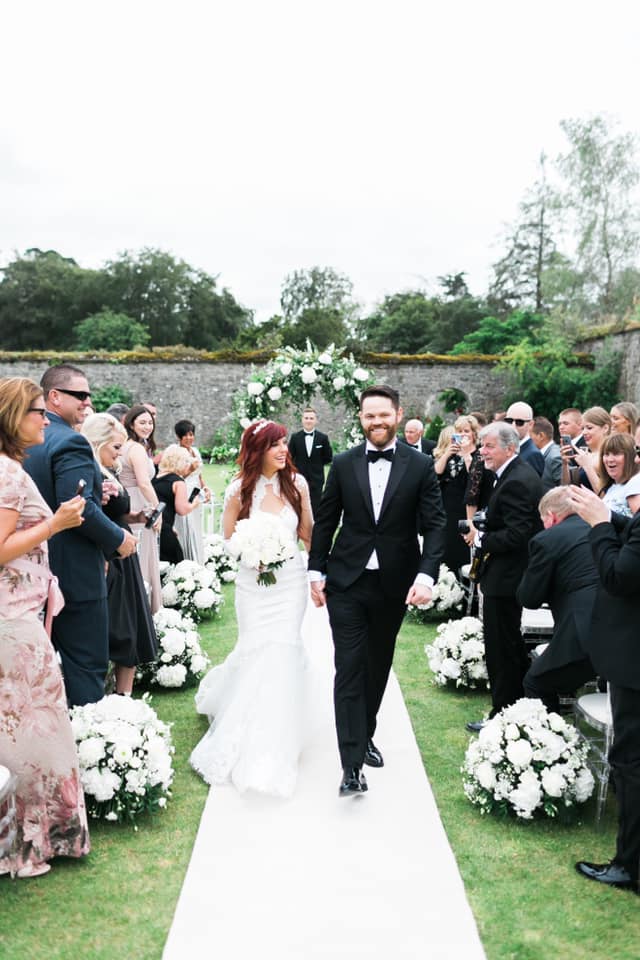 Bride and Groom walk down the aisle after the ceremony