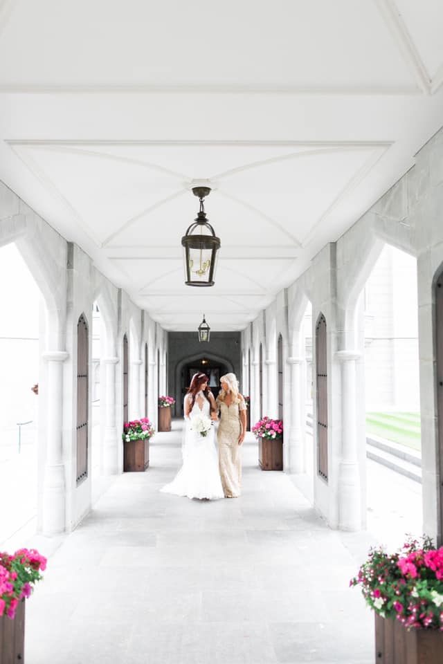 Bride and her mother walking in the manor