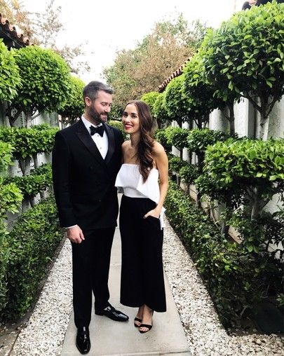 Couple wearing black tie optional dress code.