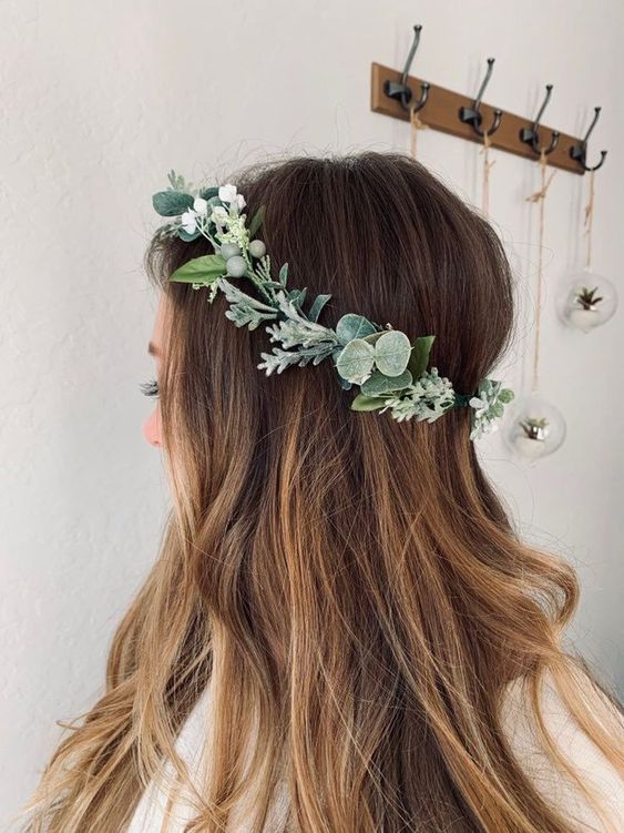 Woman wearing a wreath on her head.