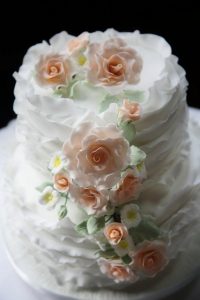 White wedding cake with pink flowers