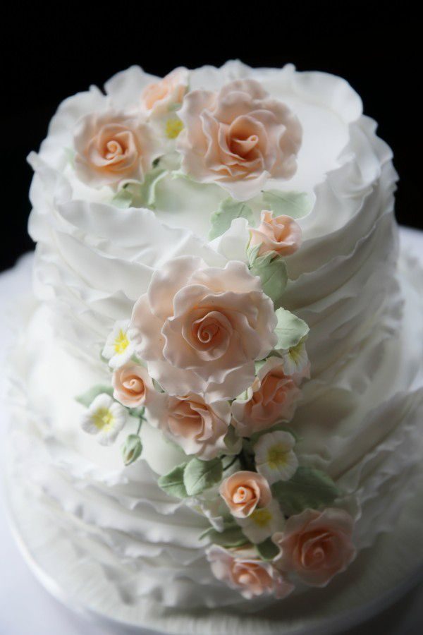 White wedding cake with pink flowers