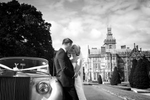 Couple kissing in front of an Irish castle