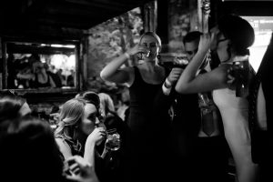 Bride taking a shot with her Bridesmaids