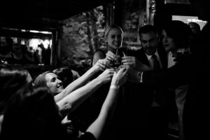 Bride taking a shot with her Bridesmaids at the pub