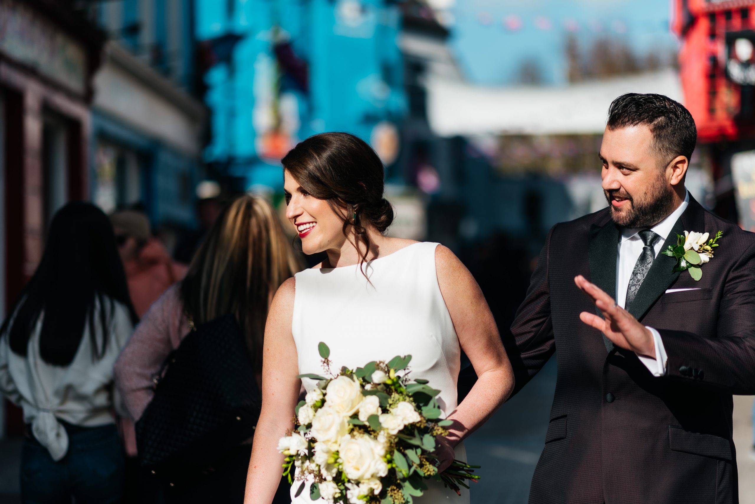 Couple waving on the streets of Galway City